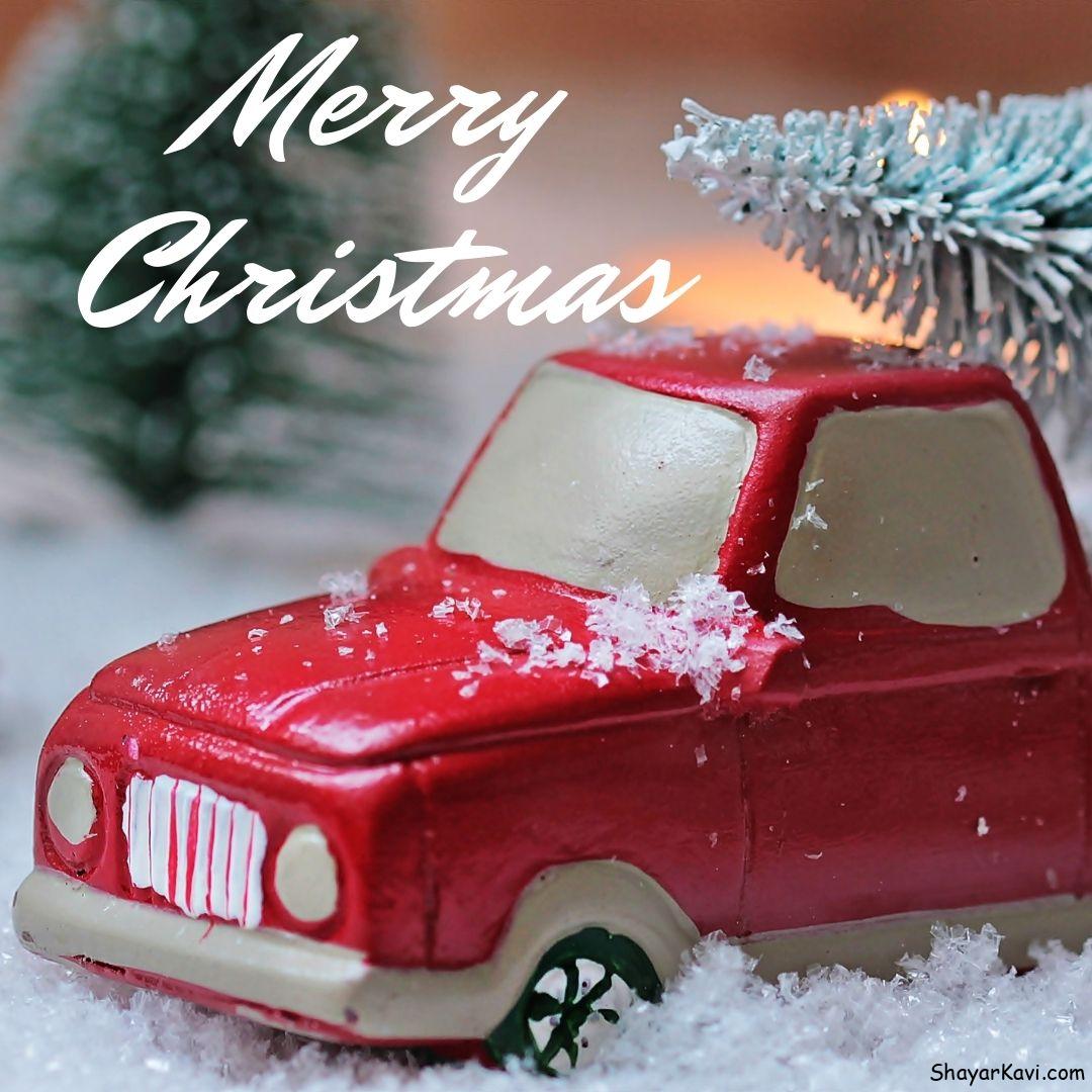 Merry Christmas and Red Kids Car in Snow